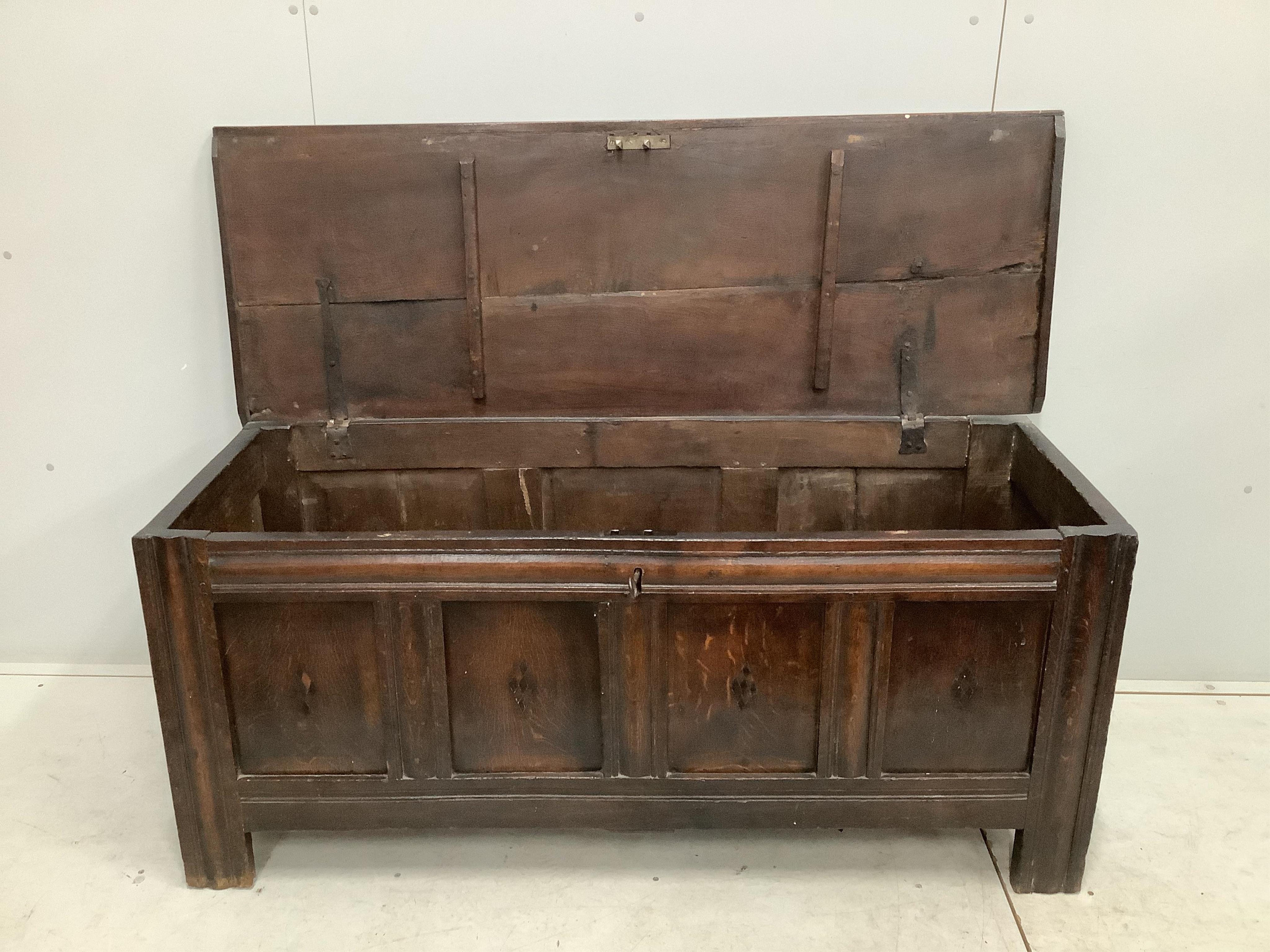 An early 18th century panelled oak coffer, width 151cm, depth 54cm, height 66cm. Condition - poor to fair